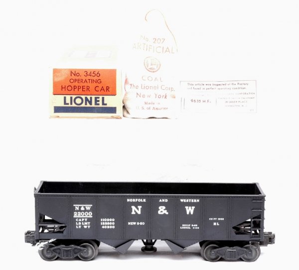 Lionel 3456 N & W Operating Hopper MINT Boxed: Lionel postwar 3456 Norfolk & Western operating hopper in OB with 207 bag of coal and inspection tag. The car has never been run, C9-10. The OB is a brick with all flaps attached, C9-10.