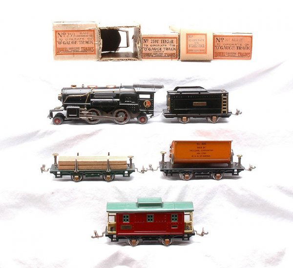 Lionel 243E Set 259E 259T 831 809 807 Boxed: Lionel prewar O gauge freight set no. 243E, circa, 1933-1934, in OBs containing; black 259E steam 2-4-2 loco, 259T tender, 831 flatcar with lumber load, 809 orange dump, red and peacock 807 caboose. L