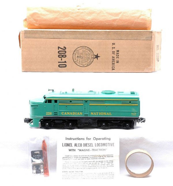 Lionel 228 Canadian National Alco A MINT Boxed: Lionel postwar uncatalogued 228 Canadian National Alco A unit, circa 1960, in OB with instruction sheet, CTC lockon, lubricant, cardboard ring and original paper. Alco has a green painted body and ope