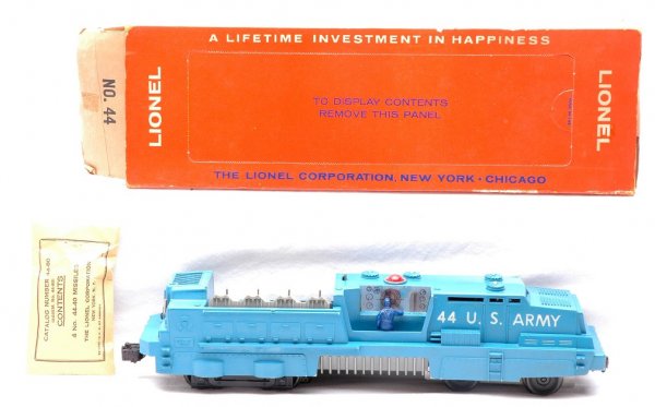 Lionel 44 US Army Mobile Launcher Boxed: Lionel postwar 44 US Army mobile launcher with packet of missiles in OB with outer panel OB. Launcher is C7. OB is sealed on one end and outer OB is a brick and is bright with panel and push in tab in