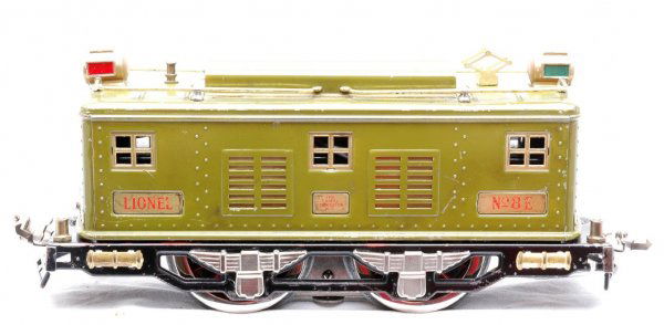 Lionel Olive Green 8E Electric 0-4-0 Loco: Lionel prewar standard gauge olive green 8E electric 0-4-0 loco with brass trim. The loco has been re-wheeled and both headlights have been replaced, C6.