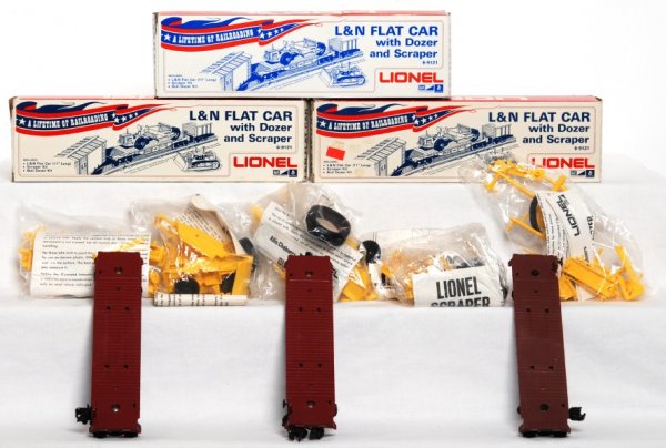 Three Lionel 9121 L&N flatcars in OB: Three Lionel 9121 L&N flatcars in original boxes, C8-9. Dozers and scrapers are in sealed bags.