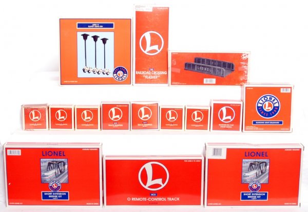 Fifteen Lionel O gauge accessories in OB: Fifteen Lionel O gauge accessories in original boxes, C8-10. 52269 510 TM I love Toy Trains blinking billboard, 22951 mainline diecast dwarf signal, two 12717 261N track bumpers set of 3, five 12715 2