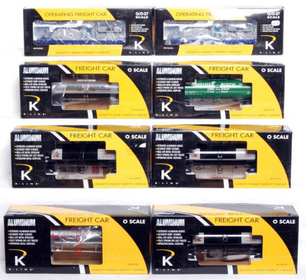 Six K-Line aluminum tank cars and two others: Two K-Line K721-5601 Bud Light rotating bottle cars and six aluminum tank cars: K6341-5602 corn syrup, three K6341-5603 corn syrup, K6341-5604 corn syrup and K6341-5601 King of Beers, C9-10.