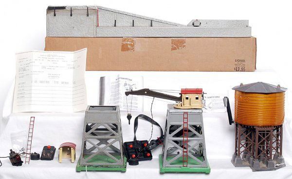 Lionel 165 crane and 138 water tower and parts: Lionel 165 magnetic crane with controller, 138 operating water tower with 96C control button and some 165 parts. Please view our photographs for the best description and as to condition of the items i