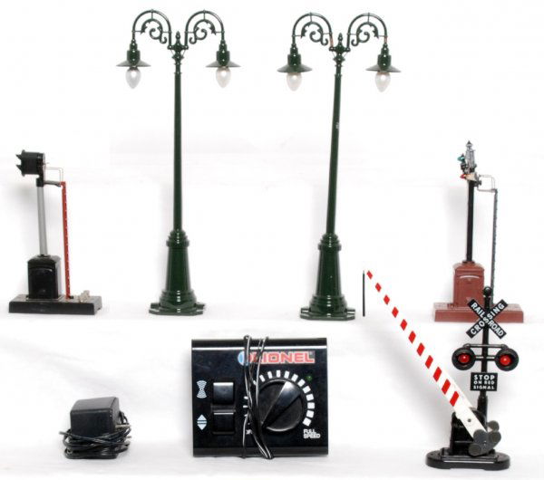 Lionel and MTH accessories, lamps, controller...: Two MTH standard gauge style lamp posts. Lionel power pack controller, crossing gate, signal. Unmarked semaphore with melting around head. Accessories look C6-7.