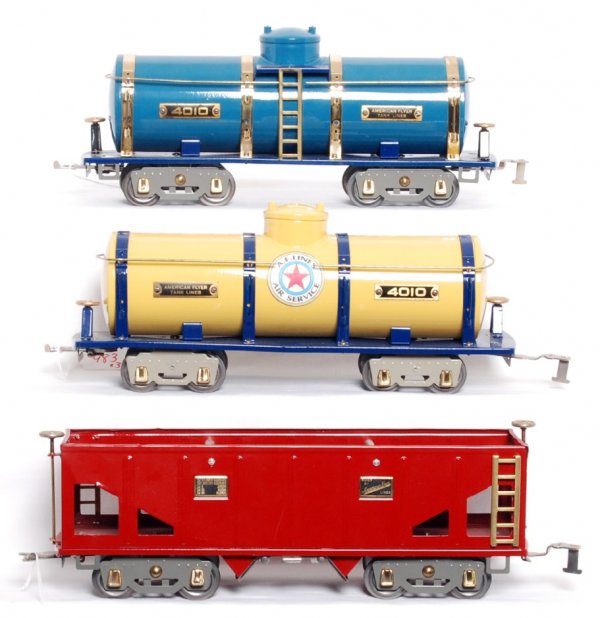 Two standard gauge American Flyer 4010 and hopper: Two standard gauge American Flyer 4010 tank cars and an unnumbered hopper, restored to look C7-8.