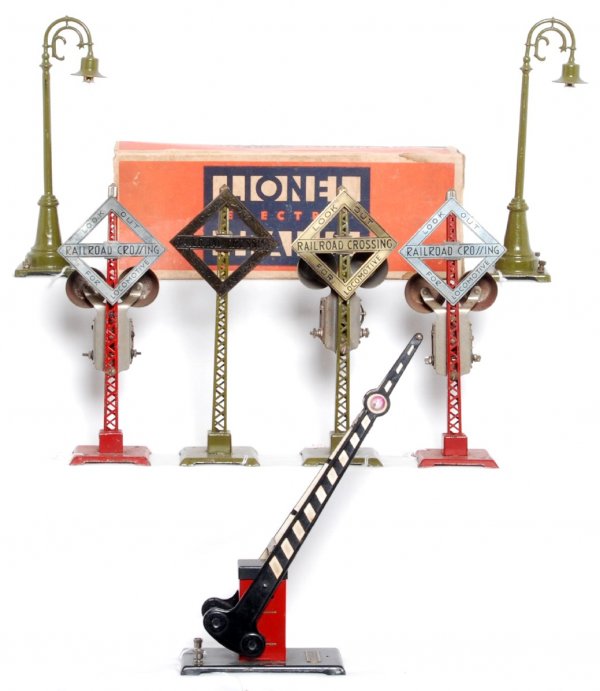 Lionel 68, 68, 69, 069, 077 in OB, more: Lionel two 68 lamp posts, 69 railroad crossing sign, 069 bell ringing signal, 077 crossing gate in OB, two unnumbered bell ringing signals, C6-7. 077 box is missing flaps.