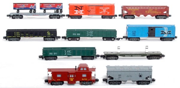 Ten American Flyer S gauge freight cars: Ten American Flyer S gauge freight cars, C6-7. 956 Monon flatcar w/trailers, 984 New Haven boxcar (with both door pins), 631 Texas and Pacific sand car (painted, one link and one conversion coupler), 