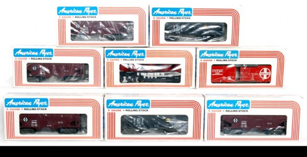 Eight American Flyer freight cars in OB: Eight American Flyer S gauge freight cars in original boxes, C8-10. Two 48602 Erie covered hoppers, four 9208 ATSF covered hoppers, 9303 Southern gondola with canisters and 9700 Santa Fe boxcar. A cou