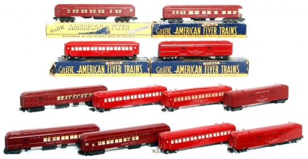 Twelve American Flyer red passenger cars: Twelve American Flyer red passenger cars and four original worn boxes, cars range from C5 to C8. 650 New Haven coach two tiny chips and a tiny hairline at steps, 918 REA operating baggage car, 650 New