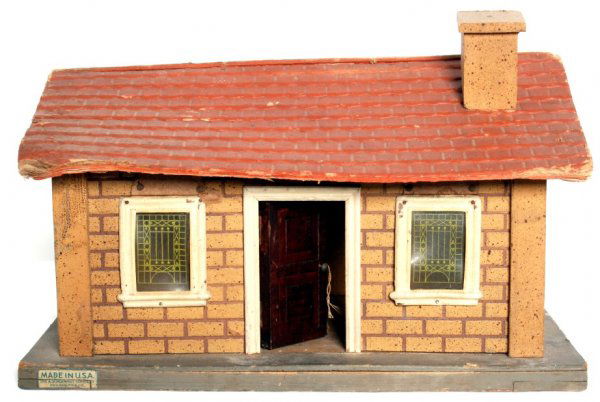 Schoenhut house/train station: Schoenhut house/train station that measures 14 inches long X 9 inches wide at the base X 9-1/2 inches tall to top of chimney. Roof is missing one gable end. There is an older illumination system parti