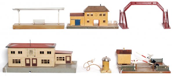 Six Marklin train accessories: Six Marklin train accessories, station, platform, stable, crossing with shack, pedestrian walk over and a bell signal, C5-6.