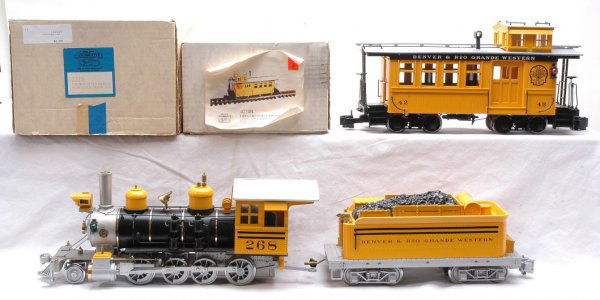 Delton Loco Works 2226 C-16 D&RGW 4274B MINT OB: Delton Locomotive Works G scale 2226 C-16 New Style Denver & Rio Grande Western steam loco and tender in OB. Also included is 4274B Denver & Rio Grande Western Drovers Caboose in OB. Both are C10.