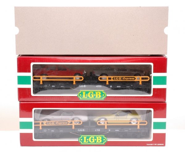 LGB 4059 4159 Auto Transports with Cars MINT OBs: LGB G scale 4059 and 4159 auto transport cars with two autos each. Both are in OBs, one has an outer sleeve, C10.