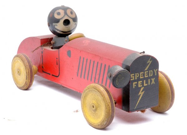 Speedy Felix Wooden Pull Toy: Speedy Felix wooden pull toy with one missing headlight and hood ornament. Felix is missing his nose and ears. The car is in C6 condition.