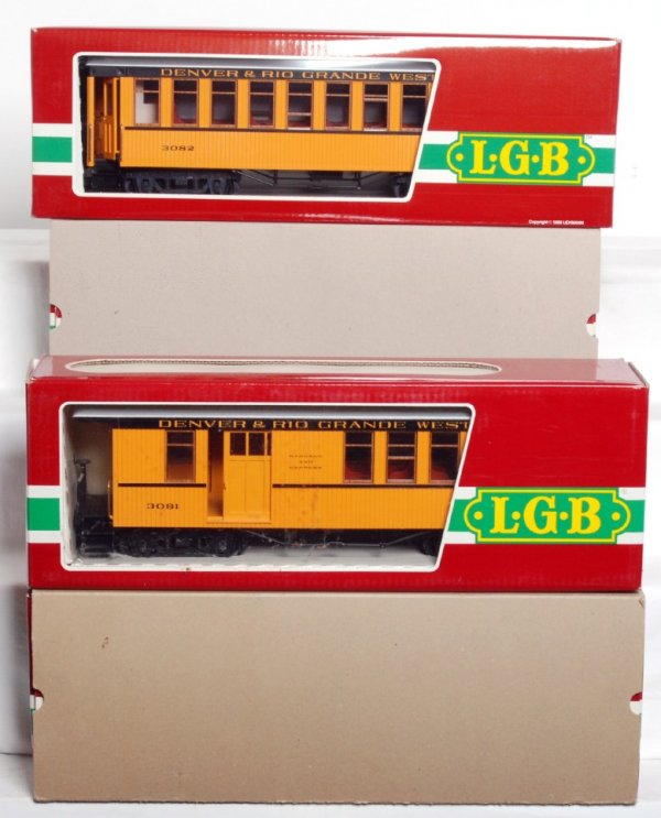 Four LGB D&RGW passenger cars in OB: Four LGB G scale Denver & Rio Grande Western passenger cars in original boxes, C9-10. 3080 coach, 3081 combine, 3181 combine and 3082 coach. Some boxes show a little light wear, price stickers.