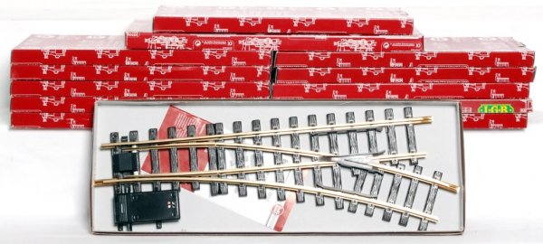 Thirteen LGB G scale track accessories in OB: Thirteen LGB G scale track accessories in original boxes, C8-10. boxes show very little to light wear, price stickers. Two 10007 Gleisubergang, level crossing, Passages a niveau; three Handweiche, rec