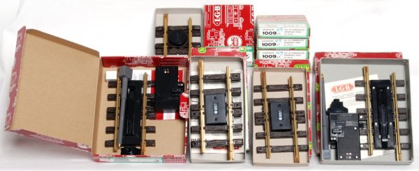 LGB G scale track accessories in original boxes: LGB G scale track accessories in original boxes, C8-10. 10560 electric uncoupler, 1056 electric uncoupler, five 1009 expandable track, 1015T insulated track and 1015K reverse loop set. Boxes have pric
