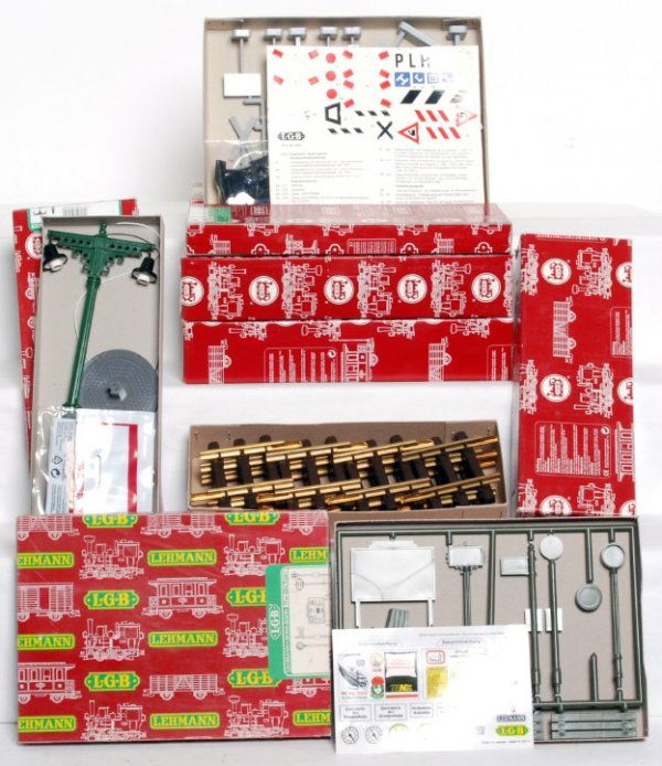 LGB G scale track accessories in original boxes: LGB G scale track accessories in original boxes, C8-10. 100882 mm, two 10320 bumpers, 50560 double station light, 5055 single station light, 5033 signs and 5032 Warnschilder (warning signs). Boxes sho