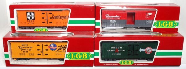 LGB G scale 42723, 4074-Z 02, 45720, 4067-F 01: LGB G scale 42723 HoodÕs Milk reefer, 4074-Z 02 Schlitz reefer, 45720 Santa Fe Grand Canyon Line and 4067-F 01 New York Central Pacemaker boxcar in original boxes, C8-10. Boxes have a price sticker a