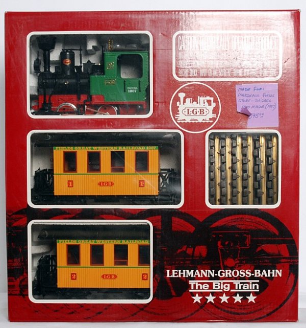 LGB G scale 20537 Fields Great Western R.R. set: LGB G scale 20537 Fields Great Western Railroad train set consisting of loco and two coaches, track and figures. Trains look 9 area, loco is graded C8 due to having been run. Box has a couple small pi