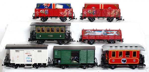 Seven LGB G scale cars two w/sound: Seven LGB G scale cars, two with sound, C7-8. Three Christmas Train freight cars, two goods cars with sound systems, two passenger coaches.