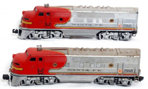 Lionel 2343 Santa Fe F3 A-A units: Lionel 2343 Santa Fe F3 A-A units with screened roof vents, original porthole lens, trains should clean nicer C6. Powered unit is missing one porthole lens and part of one plastic ladder, very clean b