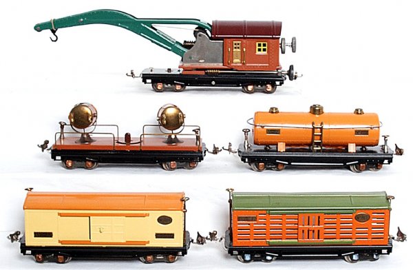 Lionel prewar 810, 813, 814, 815 and 820: Lionel prewar 810 crane, 820 searchlight car, 814 box car, 813 stock car and 815 tank car. All are restored to look C7-8.