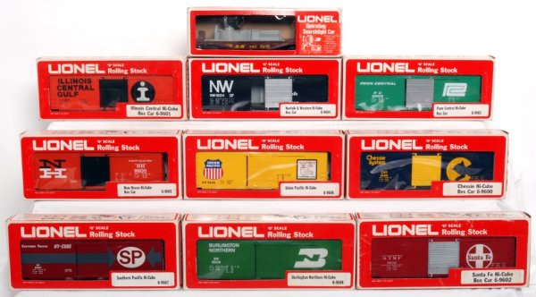 Ten Lionel freight cars in original boxes: Lionel 9606 Union Pacific boxcar, 9605 New Haven boxcar, 9604 Norfolk and Western boxcar, 9603 Penn Central boxcar, 9601 Illinois Central boxcar, 9600 Chessie boxcar, 9608 Burlington Northern boxcar, 