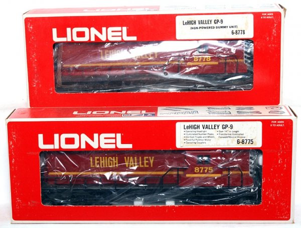 Lionel 8775 and 8778 Lehigh Valley GP-9 diesels: Lionel 8775 and 8778 Lehigh Valley GP-9 diesel locos in original boxes, trains look C9 area, powered unit might be test run. Boxes show very light wear.