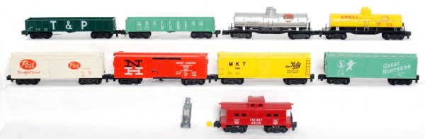 Nine American Flyer S gauge freight cars: Nine American Flyer S gauge freight cars, 24120 T&P sand car, Buffalo Hunt gondola, 24058 Post Cereal boxcar, 25082 New Haven operating boxcar with track trip and one yellow crate, 24030 MKT boxcar, 2