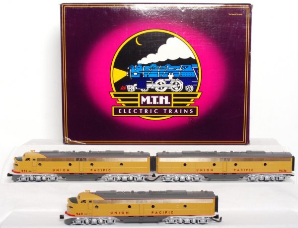 MTH 20-2208-1 Union Pacific E-8 A-B-A set in OB: MTH 20-2208-1 Union Pacific EMD E-8 A-B-A set in original box, trains look C9, graded C8 due to having been run. Box shows very light wear. Train features ProtoSound and ProtoSmoke.