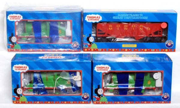 Three Lionel 18733 Percy locos & 16490 hopper: Three Lionel 18733 Percy, Thomas the Tank EngineÕs friend in original boxes and 16490 Sodor mining hopper in original box. Trains look C8-9. Boxes show little wear, price stickers.