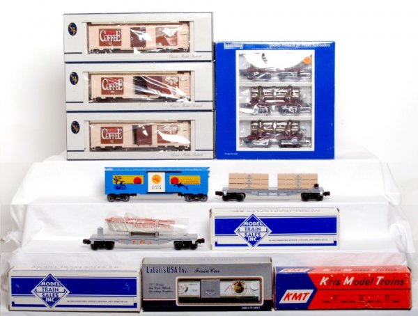 O scale freight cars in OB, MTSI, LabattÕs: O scale freight cars in orignal boxes, C8-9. LabattÕs Moretti reefer. Kris Model Trains 1981 TTOS boxcar. Three Crown Model Products Dunkin Donuts boxcars. Model Train Sales Inc. 669196 P.P.&L. boat 