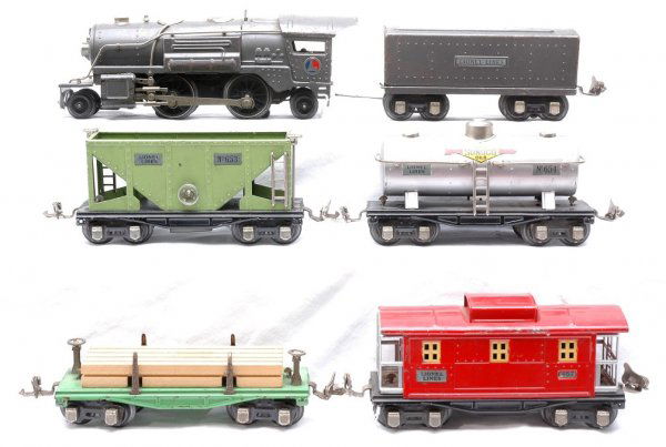 Lionel Freight Set 259E 1689W 651 653 654 657: Lionel prewar O gauge freight set containing; 259E gun-metal 2-4-2 steam loco, 1689W tender, 651 flatcar with wood load, 653 hopper, 654 silver Sunoco tank car and 657 caboose. The loco and tender are