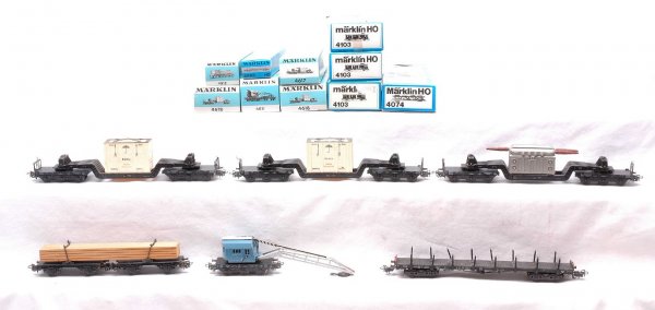 Marklin 4074 4103 4512 4611 4617 4618 4663: Marklin HO gauge ten freight cars; 4074 auto carrier, three 4103 luggage vans, 4512 timber truck, 4611 crane car, 4617 well wagon with transformers, two 4618 well wagons with cases and 4663 flatcar in