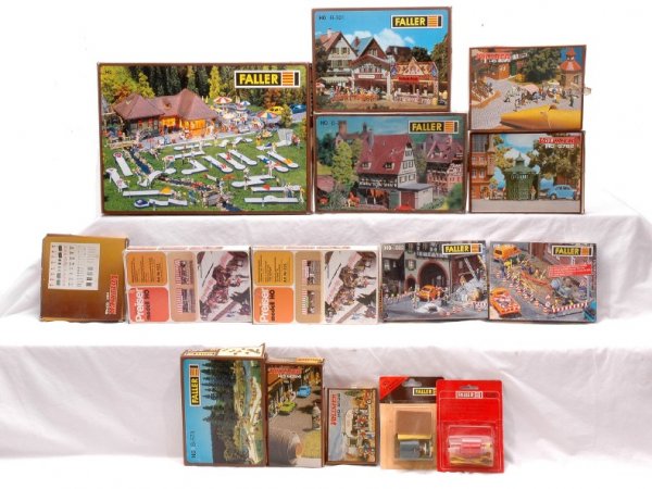 Faller Preiser and Vollmer HO Kits Boxed: Faller HO gauge kits; B-226 Olde Blacksmith, B-321 concession booths, 384 putt putt course. B-573 Picnic area, 682 building site set, 683 building site barricade, Preiser 523 and 525 stalls at Christm