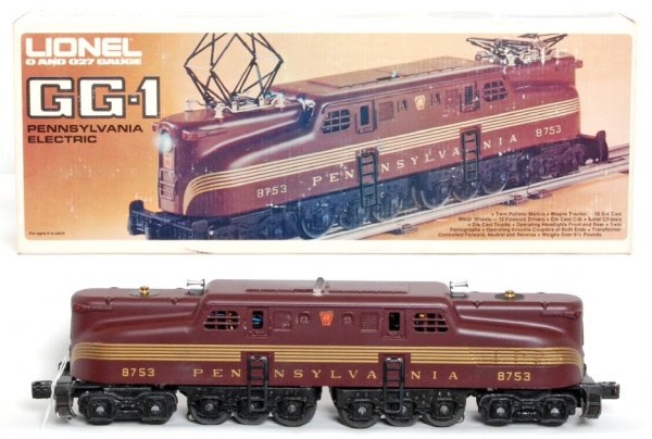 Lionel 8753 PRR GG-1 electric loco in OB: Lionel 8753 Pennsylvania five stripe Tuscan GG-1 electric loco in original box, train looks C9 graded C8 due to having been run. Box shows a little very light wear, inventory sticker.