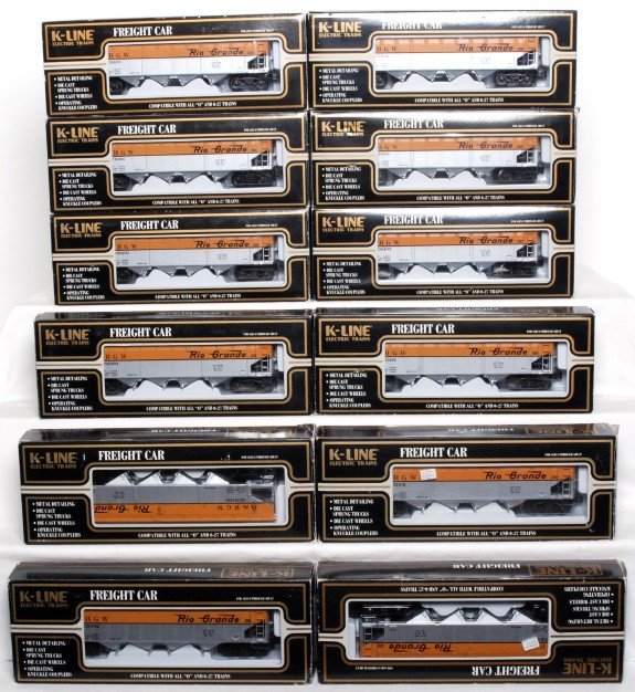 Twelve K-LIne D&RGW scale die-cast hoppers: Twelve K-Line Denver and Rio Grande Western scale diecast hoppers in original boxes, some cars are missing small truck screws, otherwise cars look C8-9. Some cars are in incorrect boxes. Boxes show li
