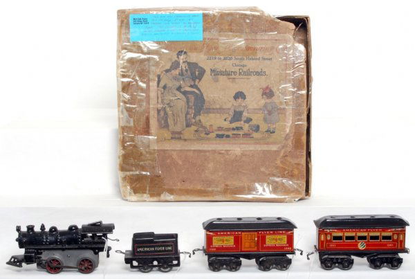 American Flyer prewar set incl. loco, 120, 1200, 1: American Flyer prewar set including loco, 120 tender, 1200 baggage and 1201 Pullman. No key for loco. Trains are nice C6-7. Box is worn, track needs some cleaning.