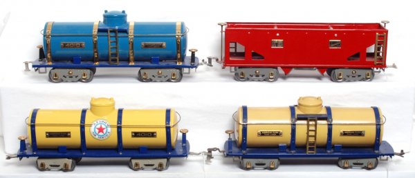 American Flyer standard gauge 4010 x 3, 4006: American Flyer prewar standard gauge cars including 4010 tank that is a possible restoration C6+. The other three cars are definite restorations and including two 4010 tank cars and one 4006 hopper, C