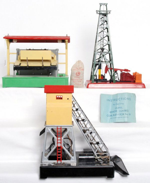 Lionel No. 97, 455, 164, 207: Lionel No. 97 coal elevator with controller, original instructions sheet Form No. 97-60-15M 1-46TT and 207 bag of artificial coal, 455 operating oil derrick and 164 operating lumber loader. Accessorie