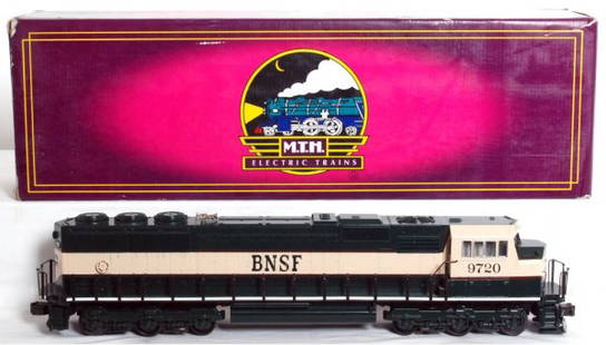 MTH 20-2154-1 BNSF EMD SD-70 MAC diesel in OB: MTH 20-2154-1 BNSF EMD SD-70 MAC diesel loco in original box, one broken snowplow, C8. Box shows light wear, price sticker.