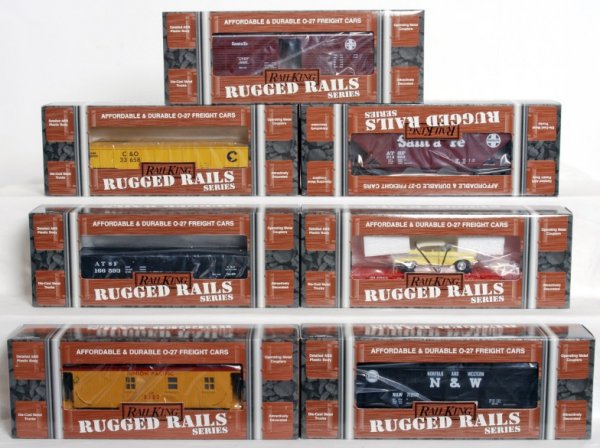 Fourteen MTH Rail King Rugged Rails Series cars: Fourteen MTH Rail King Rugged Rails Series cars in original boxes, C8-9. 33-7604 Burlington flat w/Road Legends 1957 Chevy, 33-7204 Pennsylvania gondola w/I-beam, 33-7203 Chessie gondola w/ I-beam, 33