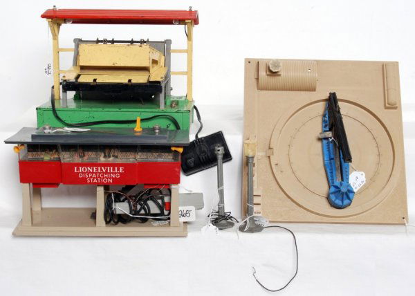 Lionel 164, 470, 465, two 35 postwar accessories: Lionel 164 log loader w/controller, 470 missile launching platform, 465 dispatching station w/microphone and two 35 boulevard lamps. Accessories look C5-6. 164 has a hairline in roof and base. 465 has