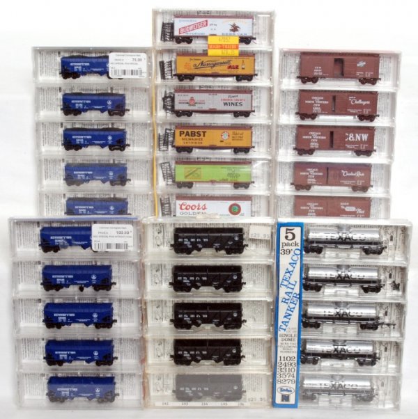 Six factory sealed packs of Micro-Trains N scale: Six factory sealed packages of Micro-Trains N scale freight cars, C10. 47032 beverage six-pack 40 foot double-sheathed wood reefers. 57082 five-pack Baltimore and Ohio 33 foot twin bay hopper w/operat