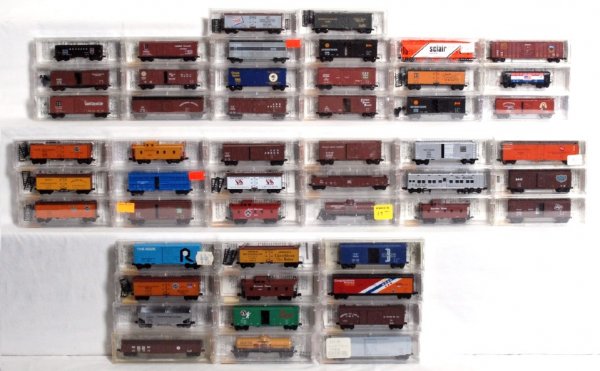 Fifty Micro-Trains N scale freight cars in OB: Fifty Micro-Trains N scale freight cars in original boxes/packages, price/inventory stickers. Boxcars, reefers, hoppers, stock cars, gondolas, etc.