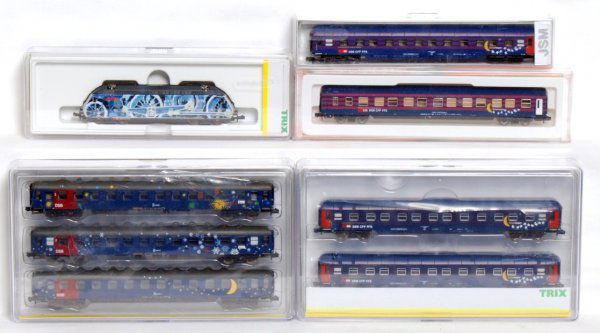 Minitrix 12783, 15911, 15913, more in OB: Minitrix N scale 12783, 15911, 15913, Schlafwagen Wagon Lit Mond and Sterne. And an Arnold 3649 in original boxes/packages, C8-10. SBB CFF FFS is on the sides of the trains.