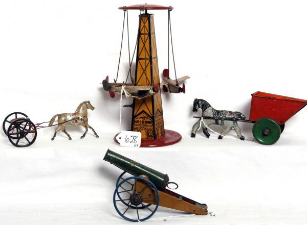 Three tin toys, The Air E Go Round, horse drawn: Three tin toys. The Air E Go Round by The Reeves Mfg. Co. animated airplane pylon, horse drawn cart, pony drawn harness and a spring loaded cannon. Pylon operates nicely, toys look C4-6.